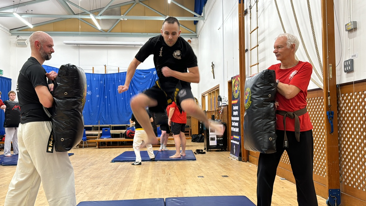 3 men at working out at martial arts classes in Surrey